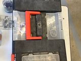 two tools sitting on a table next to each other