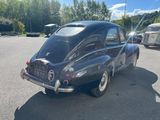 a black car that is parked in a parking lot