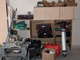a room with a lot of clutter and tools on the floor