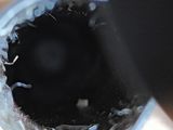 a close up of a person ' s hand holding a glass of water