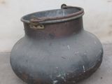 a large pot that is sitting on the ground