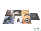 a lot of records on a white surface