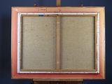 an old wooden easel with a painting on top of it
