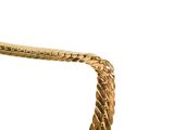 a gold bracelet that is on a white background