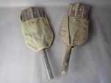 these are two old shovels sitting on top of a table
