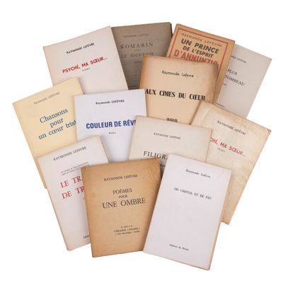 several books are stacked on top of each other on a white surface