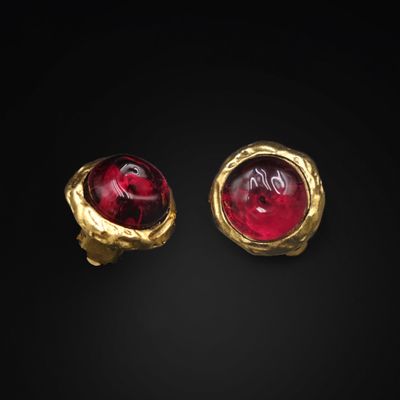 a pair of gold and red glass earrings