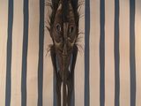 a statue of a cat that is standing on a table