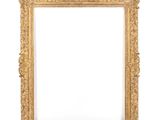 a gold frame on a white wall with a white background