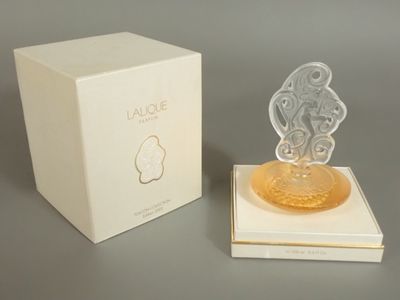 a perfume bottle that is sitting on top of a box