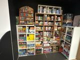 a room with a lot of food and games on the shelves