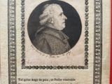an old book with a picture of a man in a suit and tie