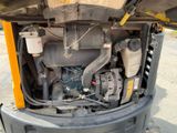 a close up view of the engine of a construction vehicle