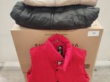 two jackets are stacked on top of each other on a box