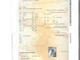 une image d'un document sur lequel figure la photo d'un homme
