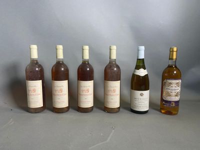 six bouteilles de vin posées les unes à côté des autres sur une table