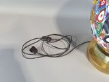 a lamp that is sitting on a table with a cord