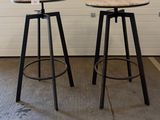 two stools sitting next to each other in a room