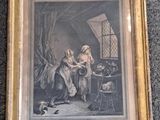 an old picture of a woman and child in a room with a dog