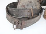 a belt and a hat sitting on a table