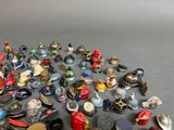 many different types of figurines displayed on a table