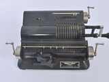 an old type of typewriter on a white surface