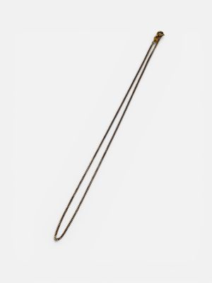 a close up of a metal object on a white surface