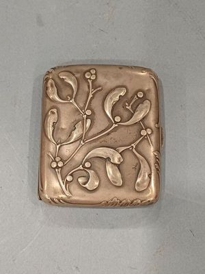 an image of a metal object with a flower design on it