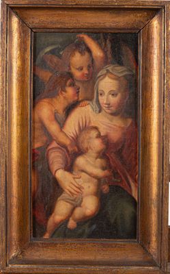 un vieux tableau représentant une femme tenant un bébé dans ses bras, dans un cadre en bois
