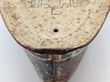 a close up of a wooden object on a white surface