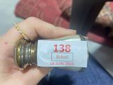 a person holding a bottle with a label on it