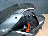 a close up of a motor scooter parked on the ground