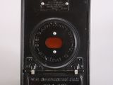 a small black camera with a red dot on it
