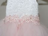 a close up of a dress on a hanger on a wall