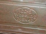 an old oven that has a sign on the side of it