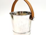 silver ice bucket with leather handle on a white background