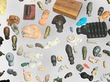 many different types of figurines displayed on a white surface