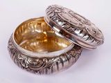 silver plated box with a lid on a white surface