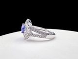 an image of a diamond and sapphire ring on a white plate