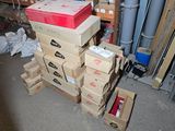 many boxes stacked on top of each other in a garage