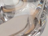 a close up of a pair of scissors in a bottle of water