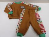 a brown and green outfit on a white table