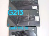 three boxes of computer keyboards sitting on a table