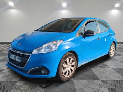 a blue car is parked in a room with a checkered floor