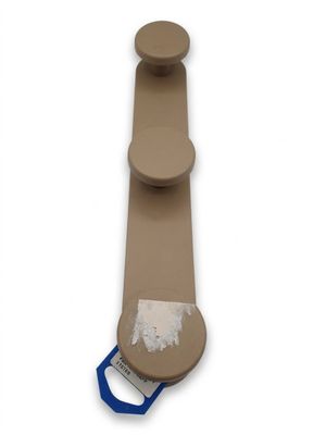 a picture of a toilet paper holder with a blue handle