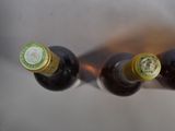 three bottles of beer sitting on top of a table