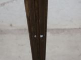 a close up of a metal pole with a hole in it