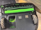a black and green robot that is on a table