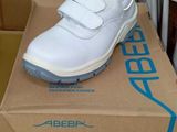 a box with a pair of white shoes on it
