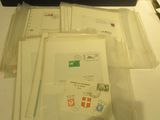 several envelopes are sitting on a table next to a computer